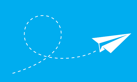 Vector illustration of a paper plane flying against a blue background.