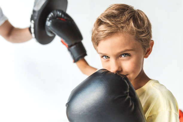 istock father and son boxing together 954082712