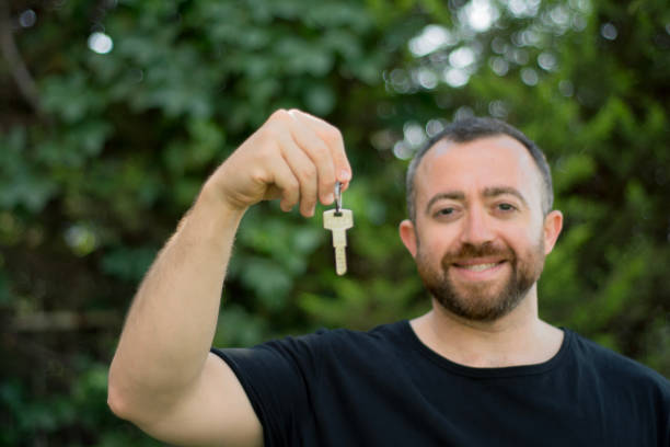 istock Man Holding His House Keys 954082898