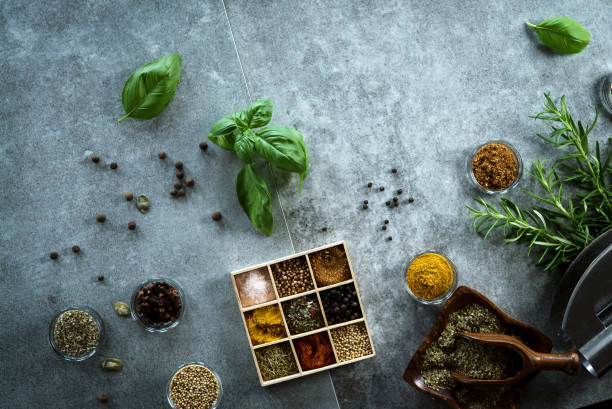 istock A collection of fresh spices on a gray stone table 954083494