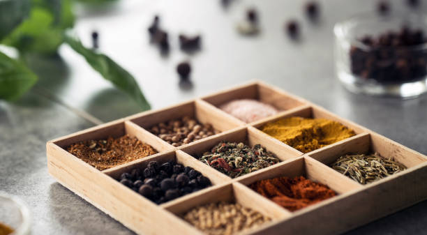 istock A collection of fresh spices on a gray stone table 954084020
