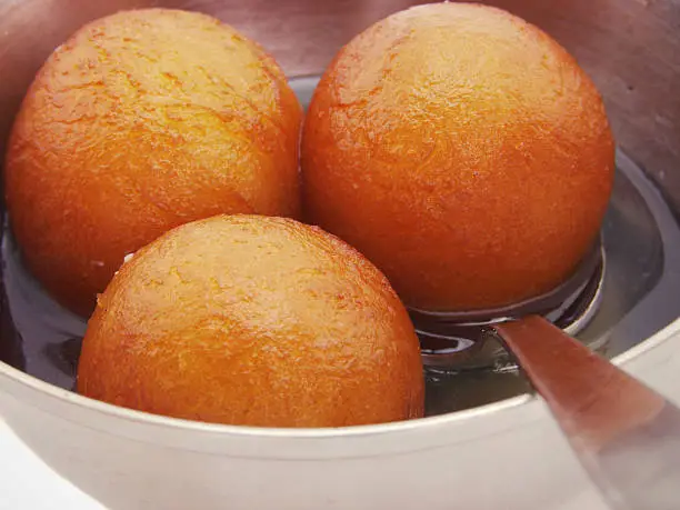 A closeup image showing indian sweet dish called "gulab jamun".