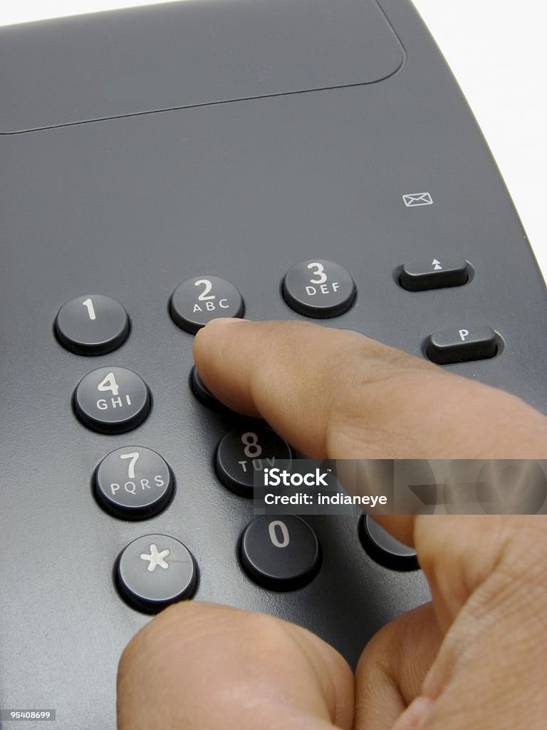 Dedo pressionando um teclado de telefone - Foto de stock de Apoio royalty-free