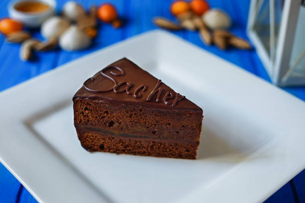 istock Traditional sacher cake sliced on white squared plate 954087118