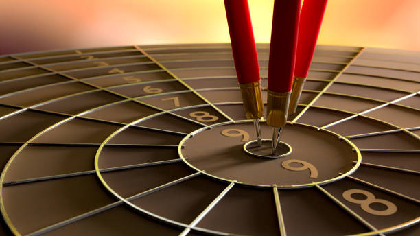 istock Darts hitting in the target center 954089356