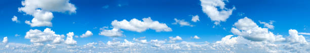 istock panorama Sunlight with blue sky on dark background.Vivid sky on white cloud. 954089688