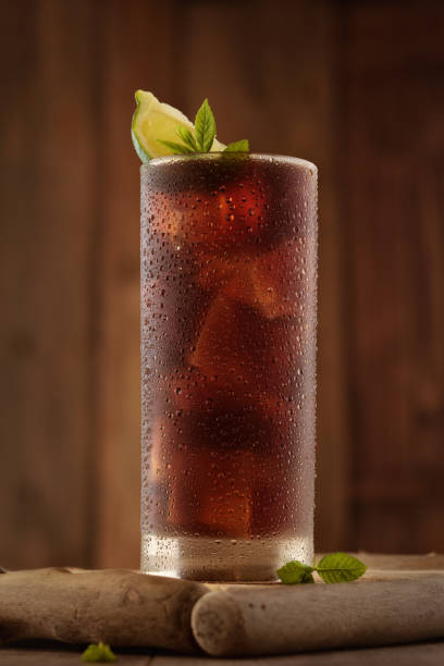istock Glass of cola with ice. 954090570