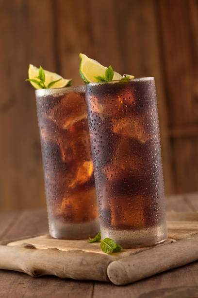 istock Glass of cola with ice. 954090588