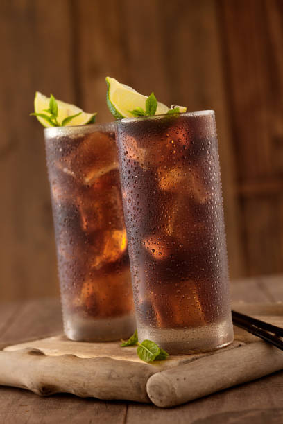 istock Glass of cola with ice. 954090642