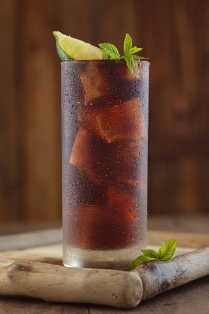 istock Glass of cola with ice. 954090668
