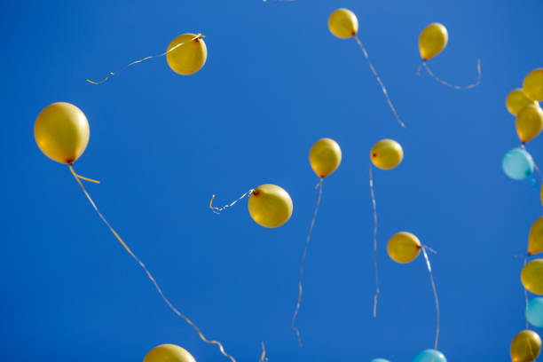 istock Floating balloons in the blue sky 954091044