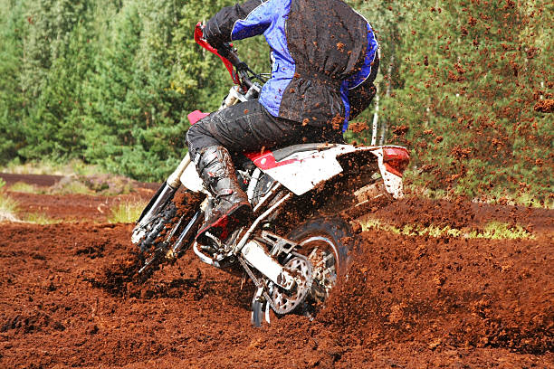 istock Off-road motorbike cornering in dirt 95409227