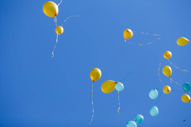 istock Group of floating balloons in the blue sky 954092484