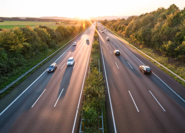 istock The road traffic on a motorway at sunset 954094968
