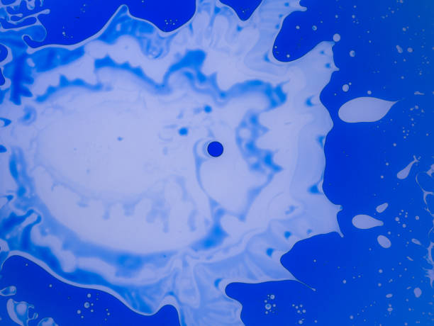 istock The abstract background with paints on a glass 954097492