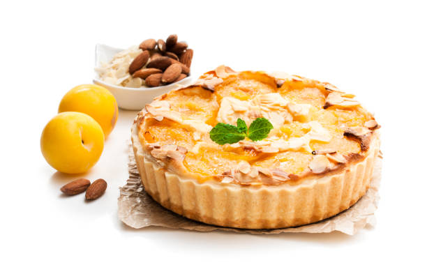istock Delicious  tart with yellow plum and almonds isolated on white 954103238