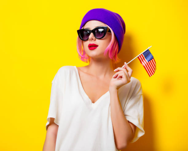 istock girl holding United States flag 954105270