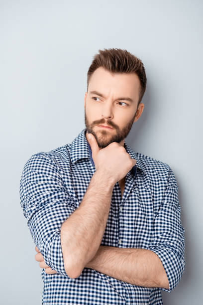 istock Portrait of young thoughtful businessman thinking about his work 954108222