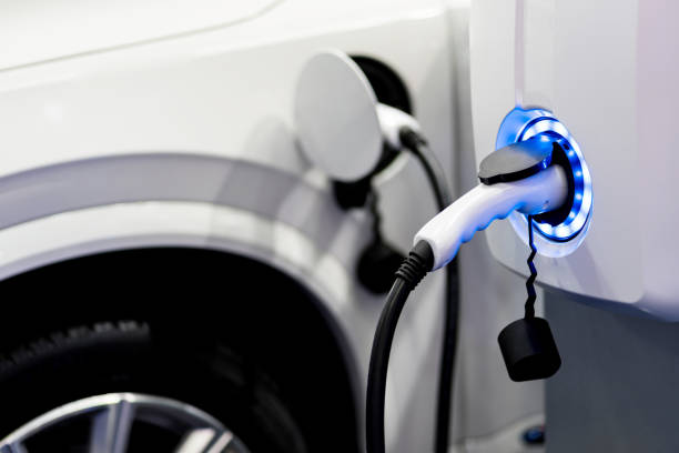 Charging an electric car battery access to vehicle electrification stock photo