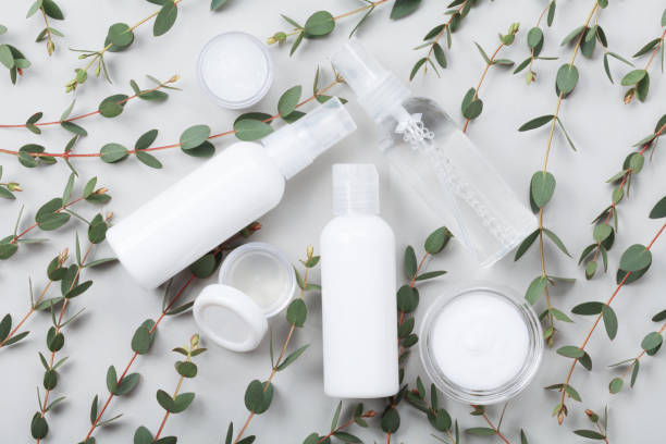 istock Pattern from set of organic natural cosmetic and eucalyptus leaf on gray table top view. Flat lay. 954120190