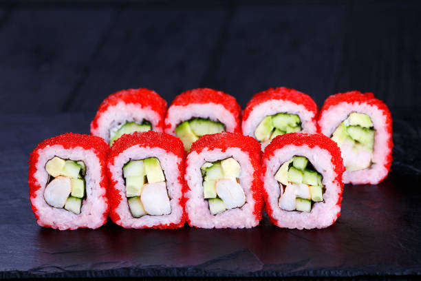 istock Sushi roll with avocado, cheese and red caviar 954120274