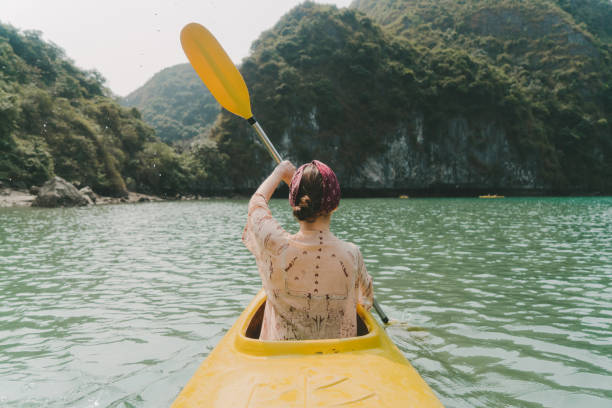 istock Woman kayaking in Halong Bay 954121864