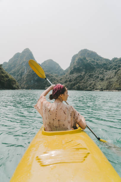 istock Woman kayaking in Halong Bay 954121902