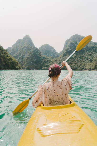 istock Woman kayaking in Halong Bay 954121912