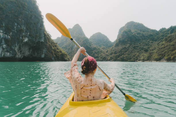 istock Woman kayaking in Halong Bay 954121958