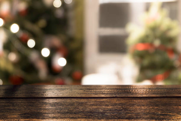 istock Christmas holiday background with empty wooden table top. 954122132