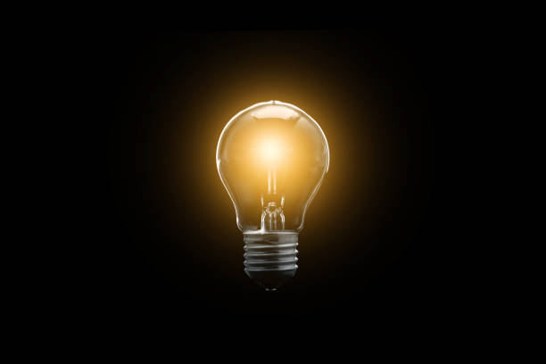 istock The electric bulb is glowing on a dark background. The concept is a successful idea. 954124394