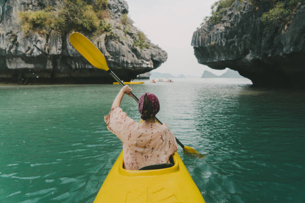 istock Woman kayaking in Halong Bay 954124810
