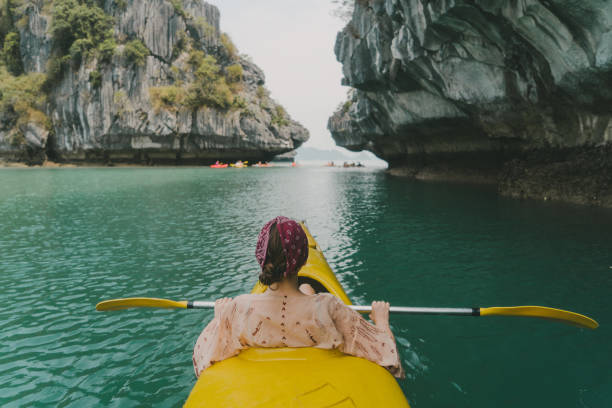 istock Woman kayaking in Halong Bay 954124816
