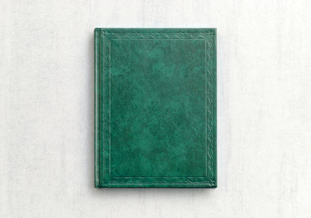 mock up book green color on gray background close-up, top view
