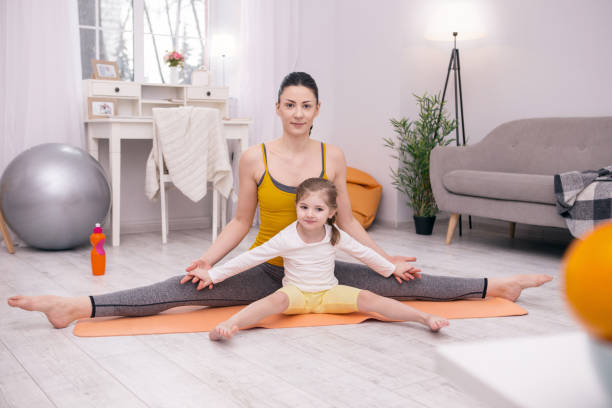 istock Happy mother training her little daughter 954130170
