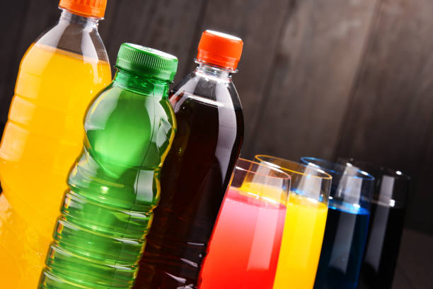 istock Glasses and bottles of assorted carbonated soft drinks 954130186