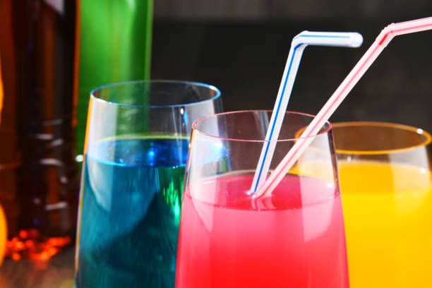 istock Glasses and bottles of assorted carbonated soft drinks 954130202