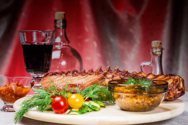 Delicious smoked ribs with spices and vegetables on the table