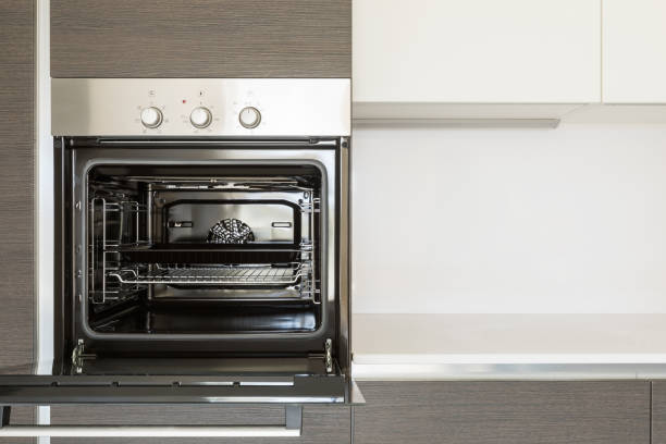 Detail of open kitchen oven. Copy space