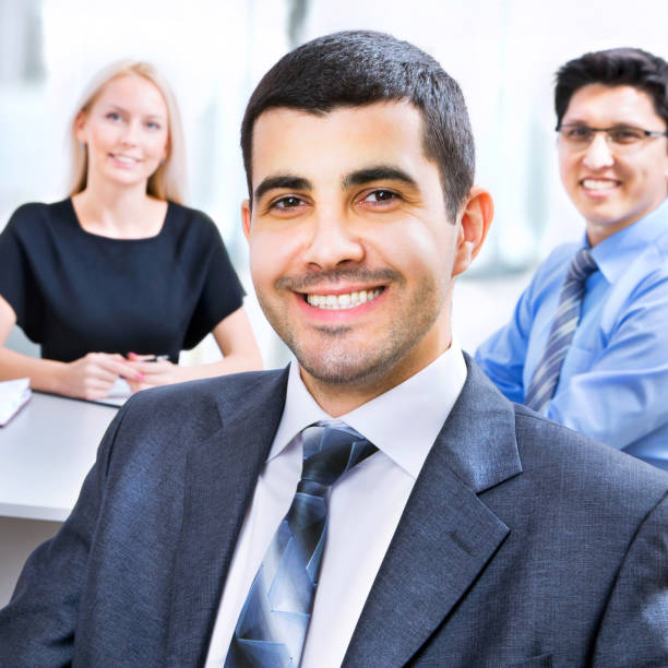 istock Business man with colleagues 954139578