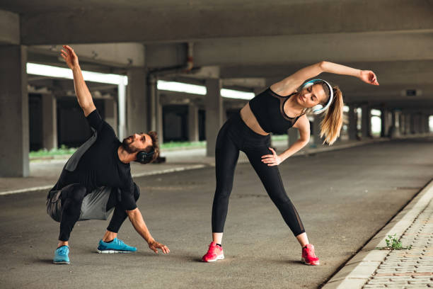 istock Young couple stretching before workout outdoor 954139878
