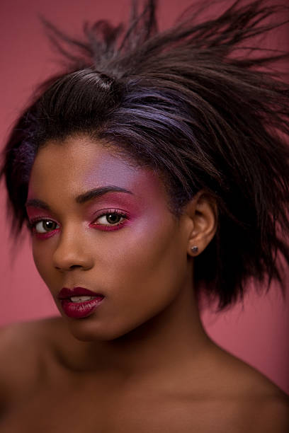 Beautiful Black Woman with Purple Makeup stock photo