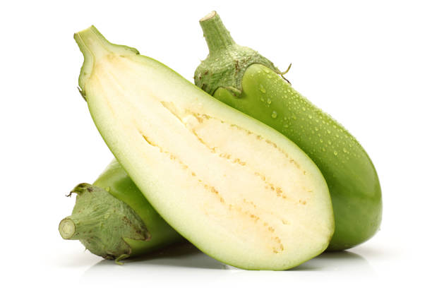 istock Portion cut fresh green long eggplant on white background 954140812