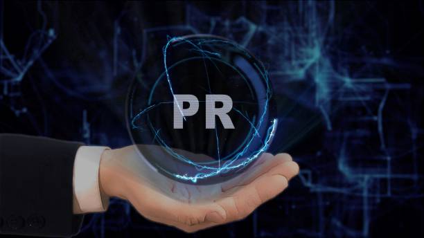 istock Painted hand shows concept hologram PR on his hand 954141328