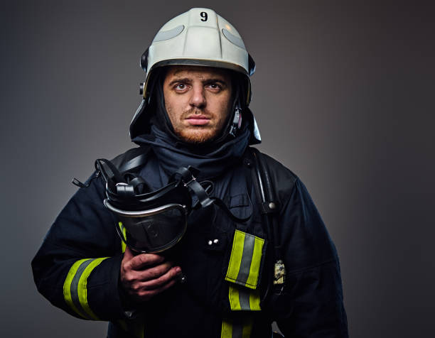 istock Studio portrait of firefighter dressed in uniform. 954145594