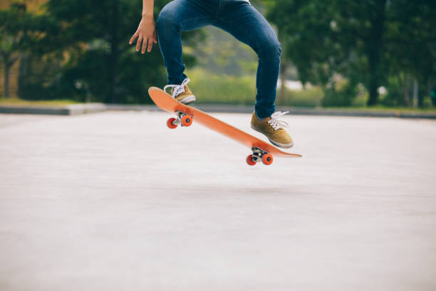 istock Skateboarder sakteboarding on parking lot 954146028