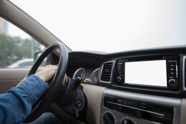 istock Hands on wheel driving car in city 954150260