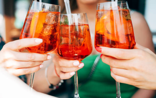 istock Woman toasting with Spritz cocktails 954150302