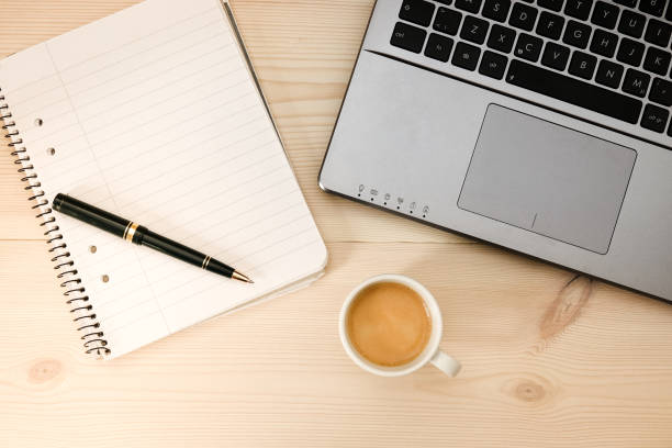 istock Espresso / coffee in front of a laptop and a writing pad 954155034