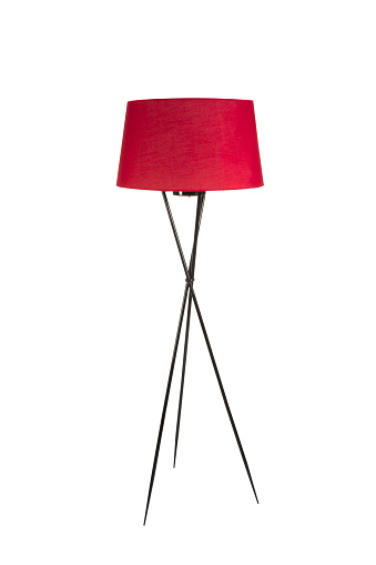 Lámpara de pie trípode rojo aislada sobre fondo blanco photo